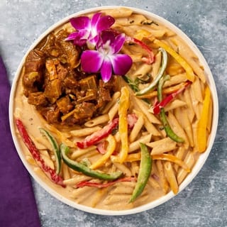 Rasta Pasta w/ Curry Goat