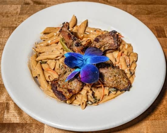 Rasta Pasta with Grilled Lamb Chop.