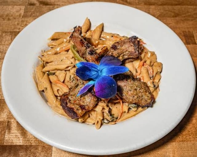 Rasta Pasta with Grilled Lamb Chop.